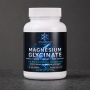 Magnesium glycinate supplement bottle front view with white cap and dark label.